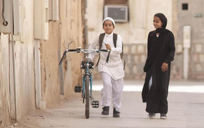 Wadjda (Waad Mohammed) wants a bicycle to race her friend Abdullah (Abdullrahman Al Gohani). Courtesy Razor Film Produktion