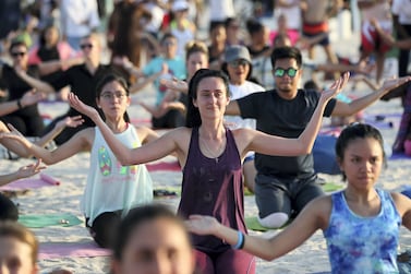 Dubai, United Arab Emirates - October 27th, 2017: Visitors participate in Cassey Ho's pilates. She is a fitness influencer and American pilates star at Dubai fitness challenge. Friday, October 27th, 2017 at Kite Beach, Dubai. Chris Whiteoak / The National