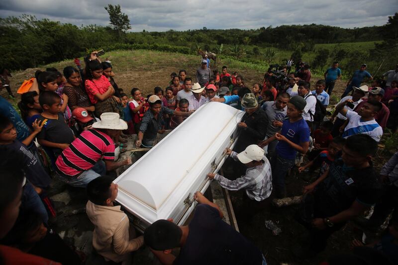 epaselect epa07248560 Family members and supporters attend the burial of Jakelin Caal Maquin in the community of San Antonio Secortez, Guatemala, 25 December 2018. After making a tour through the remote community of San Antonio Secortez, in the north of Guatemala, first in front of her grandfather's house, then to her mother's home and to the church, the body of Jakelin Caal Maquin entered the cemetery today for her last goodbye. The child died 17 days ago in the USA after falling ill while in the custody of US Customs and Border Patrol.  EPA/EDWIN BERCIAN