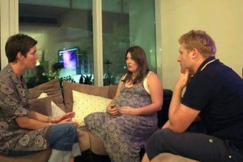 Doula Natalie, left, conducts a pre-natal session with two of her clients in their Abu Dhabi home. Ravindranath K / The National