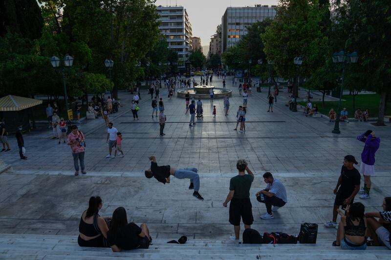 Young men dance is Syntagma square, central Athens.