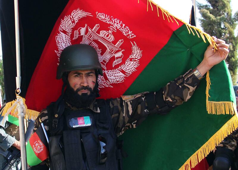 epa07780281 An Afghan soldier marks the Independence Day in Helmand, Afghanistan, 19 August 2019.  Afghanistan is celebrating the 100th anniversary of its independence from British rule on 19 August.  EPA/WATAN YAR