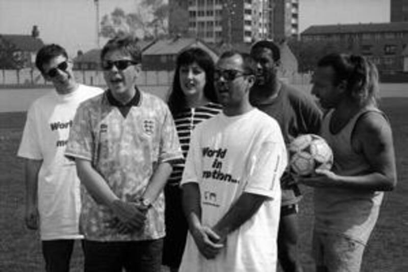 Members of the English rock group New Order with the comedian Keith Allen (second from right) and the footballer John Barnes (third from right) after they recorded World in Motion in 1990.