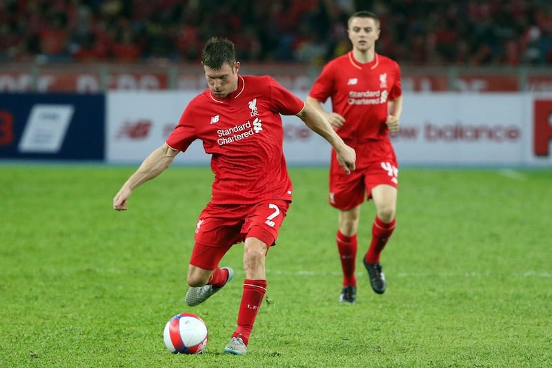 James Milner's steady production will be crucial to Liverpool's goal of reestablishing the club amongst the elite in 2015/16. How Foo Yeen / Getty Images