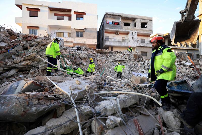 Emirati rescuers sift through the rubble 