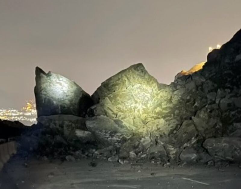 Footage widely shared on social media showed large rocks on the road leading to the mountain area. Photo: Ahmed bin Sulayem