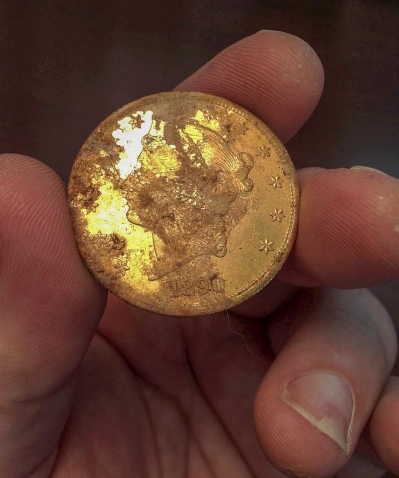 An 1890 gold coin that is part of a collection of coins found buried on private property in California’s gold region. Kagin’s Inc / EPA