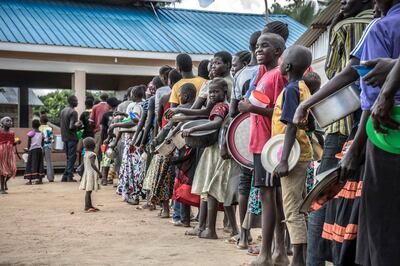 KULUBA REFUGEE RECEPTION CENTER, KULUBA, UGANDA - 2018/05/08: South Sudanese refugee seen lining up to get their ration of food supply in Kuluba refugee reception center. (Photo by Alda Tsang/SOPA Images/LightRocket via Getty Images)