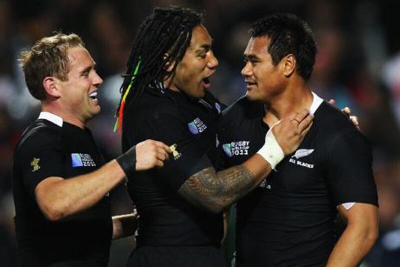 HAMILTON, NEW ZEALAND - SEPTEMBER 16: Isaia Toeava (R) of the All Blacks is congratulated by team mates Ma'a Nonu (C) and Andy Ellis after scoring his try during the IRB 2011 Rugby World Cup Pool A match between New Zealand and Japan at Waikato Stadium on September 16, 2011 in Hamilton, New Zealand.  (Photo by Phil Walter/Getty Images)