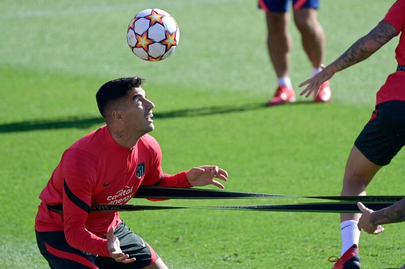 Atletico Madrid forward Luis Suarez heads the ball during training in Majadahonda on the eve of their Champions League Group B match against AC Milan on Tuesday, Septembert 28. AFP