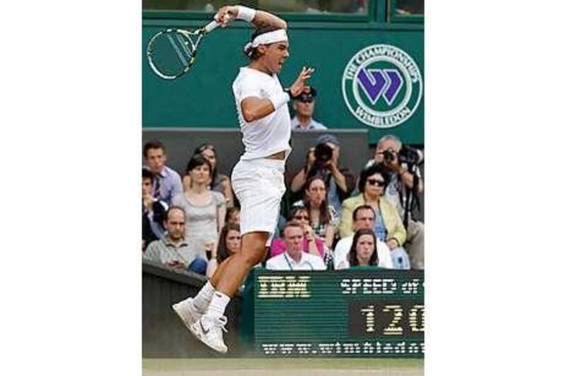 Spain's Rafael Nadal send in a whipping forehand return to Tomas Berdych of the Czech Republic.