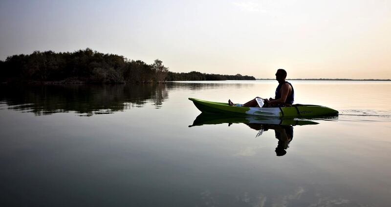 A kayaker navigates the calm waters near Abu Dhabi’s Eastern Mangroves reserve. Silvia Razgova / The National 