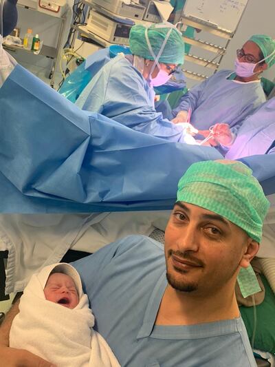 Khadijeh Cheragheleh cradles his son, Diyab, born shortly after midnight on the 48th UAE National Day. Courtesy Al Zahra Hospital