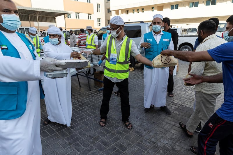 The Sri Lanka community along with the help of the Watani Al Emirate Foundation collectvely distributed two thousand / 2000 Iftar meals to workers in the Sonapur area of Dubai to mark International Workers Day on May 1st, 2021. 
Antonie Robertson / The National.
Reporter: None for National