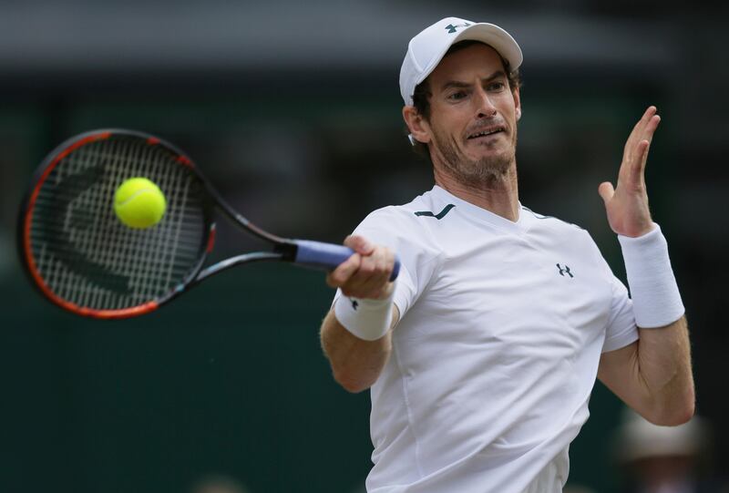 FILE -  This July 12, 2017 file photo shows Britain's Andy Murray returning to Sam Querrey of the United States during their Men's Singles Quarterfinal Match at the Wimbledon Tennis Championships in London. Murray surprisingly announced his withdrawal from the U.S. Open on Saturday, Aug. 26, 2017 because of a hip injury. (AP Photo/Tim Ireland, file)