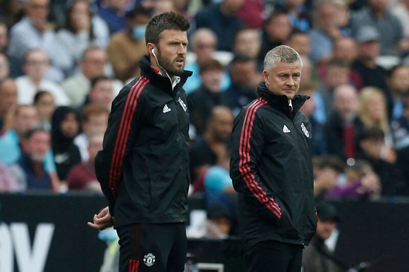 Michael Carrick, left, was assistant manager to Ole Gunnar Solskjaer, right, and has now been given the top job until Manchester United appoint their next manager. AFP