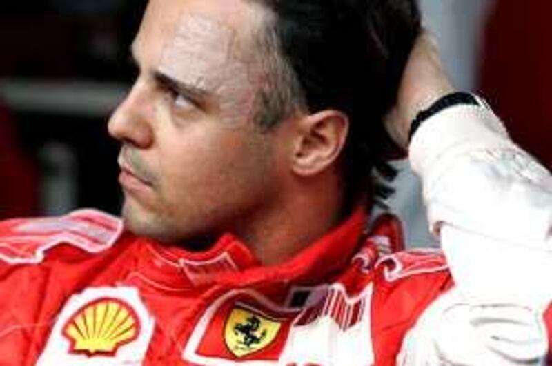 Ferrari's driver Brazilian Felipe Massa gestures at the Granja Viana karting track, in Cotia, 24 km west of Sao Paulo, Brazil, October 1, 2009. AFP PHOTO / Nelson ALMEIDA *** Local Caption ***  934227-01-08.jpg