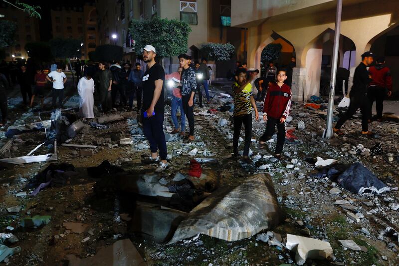 Palestinians survey the damage of an Israeli strike in Khan Younis in the southern Gaza Strip. Reuters