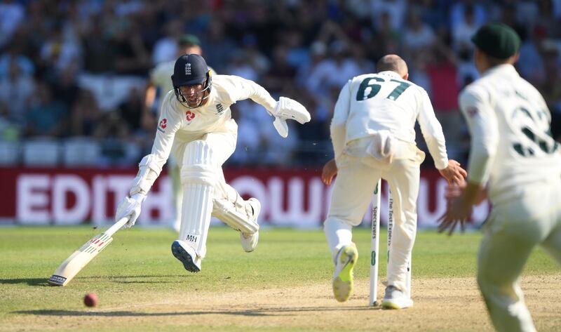 Jack Leach evades being run out as Nathan Lyon fumbles the ball. Getty Images