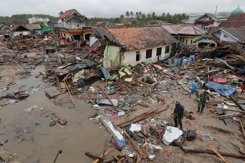 Soldiers inspect the damage in Sumur. AP Photo