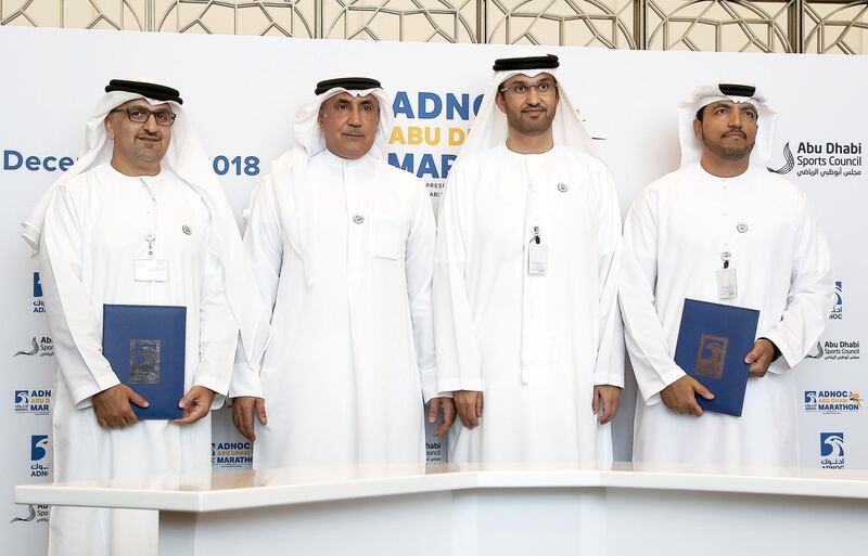 ABU DHABI , UNITED ARAB EMIRATES , JULY 3 – 2018 :- Left to Right -  Aref Hamad Al Awani , General Secretary of Abu Dhabi Sports Council , Major General Mohammed Khalfan Al Romaithi , Chairman of General Authority for Sports , Sultan Ahmed Al Jaber , Minister of State , UAE , Director General & CEO of ADNOC  and Omar Suwaina Al Suwaidi , Executive Office Director at ADNOC during the signing ceremony and press conference of First ADNOC Abu Dhabi Marathon held at ADNOC headquarters in Abu Dhabi. The long distance race will be held for the first time on December 7, 2018.  ( Pawan Singh / The National )  For Sports. Story by Amit 