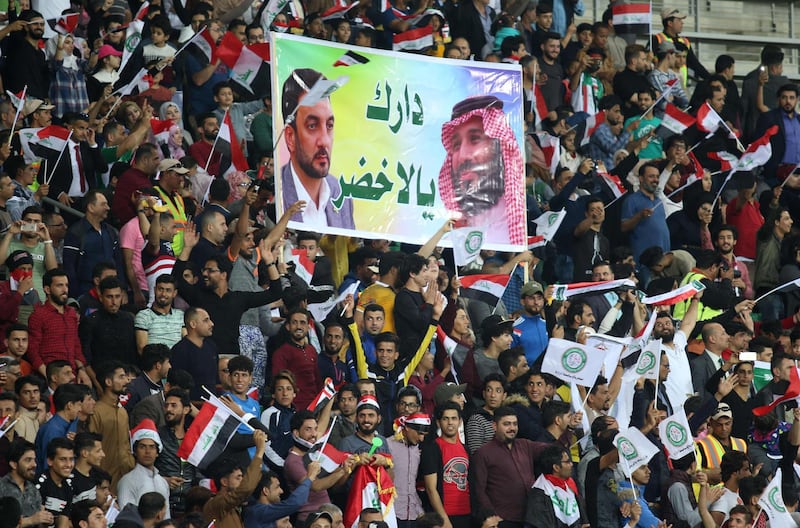 Iraqi fans cheers on their national team prior to the start of their international friendly football match between Iraq and Saudi Arabia at the Basra Sports city stadium in Basra on February 28, 2018. 
Iraq has not played full internationals on home turf ever since its 1990 invasion of Kuwait that sparked an international embargo. Iraq won the match 4-1 / AFP PHOTO / HAIDAR MOHAMMED ALI