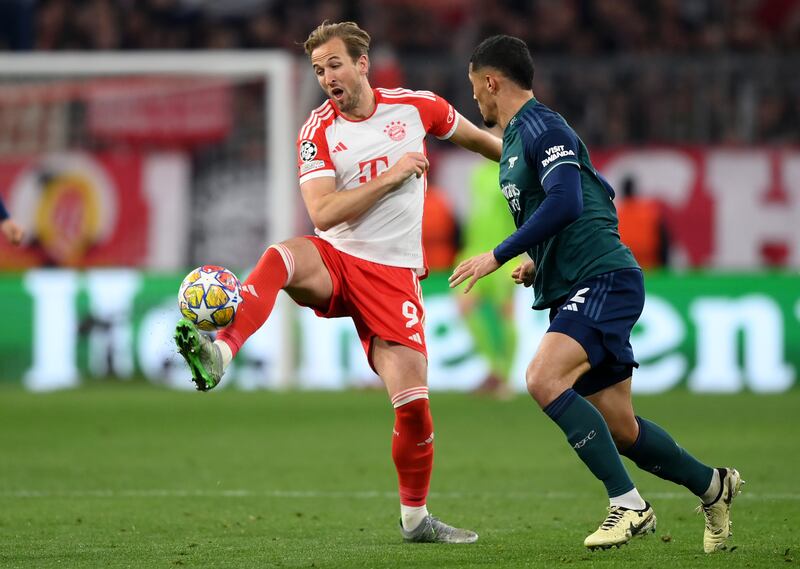 Bayern striker Harry Kane attempts to control the ball under pressure from Arsenal defender William Saliba. Getty Images