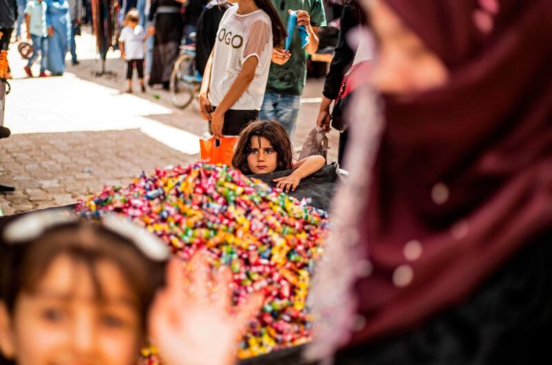 Piles of candy at the main market of the Kurdish-majority city of Qamishli in Syria's northeastern Hasakeh province on May 19, 2020, ahead of Eid. Delil Souleiman / AFP