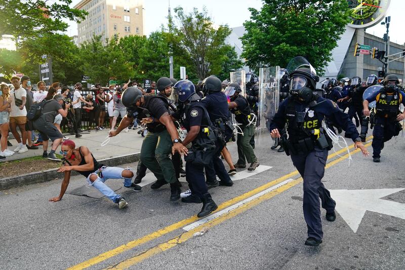 Police detain protesters in Atlanta, Georgia. Getty Images