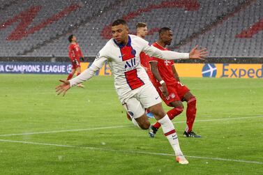 MUNICH, GERMANY - APRIL 07: Kylian Mbappe of Paris Saint-Germain celebrates after scoring their side's first goal during the UEFA Champions League Quarter Final match between FC Bayern Munich and Paris Saint-Germain at Allianz Arena on April 07, 2021 in Munich, Germany. Sporting stadiums around Germany remain under strict restrictions due to the Coronavirus Pandemic as Government social distancing laws prohibit fans inside venues resulting in games being played behind closed doors. (Photo by Alexander Hassenstein/Getty Images)