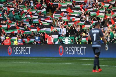 Celtic fans hold up Palestine flags during the match against Israeli side Hapoel Be’er Sheva. Reuters