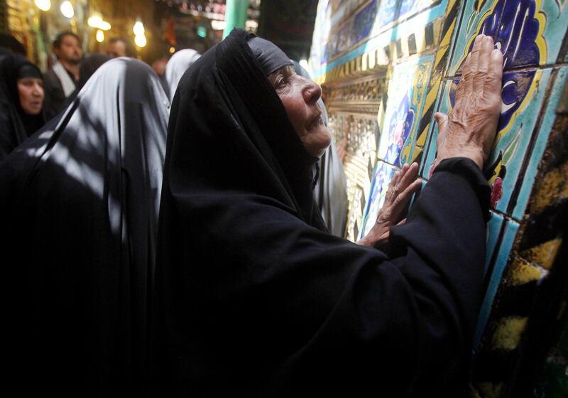 TOPSHOTS

Iraqi women pray at the shrine of Imam Abbas bin Ali ibn Abi Taleb, one of Shiite Islam's most revered figures, during the Shaabaniya ceremony commemorating the birth of Imam al-Mahdi, the 12th holiest figure for Shiite Muslims, in the city of Karbala, on July 5, 2012. Mahdi is the 12th Imam who disappeared in the ninth century and Shiites believe that he will appear before the end of time to establish justice and true Islam in the world. AFP PHOTO/AHMAD  AL-RUBAYE

