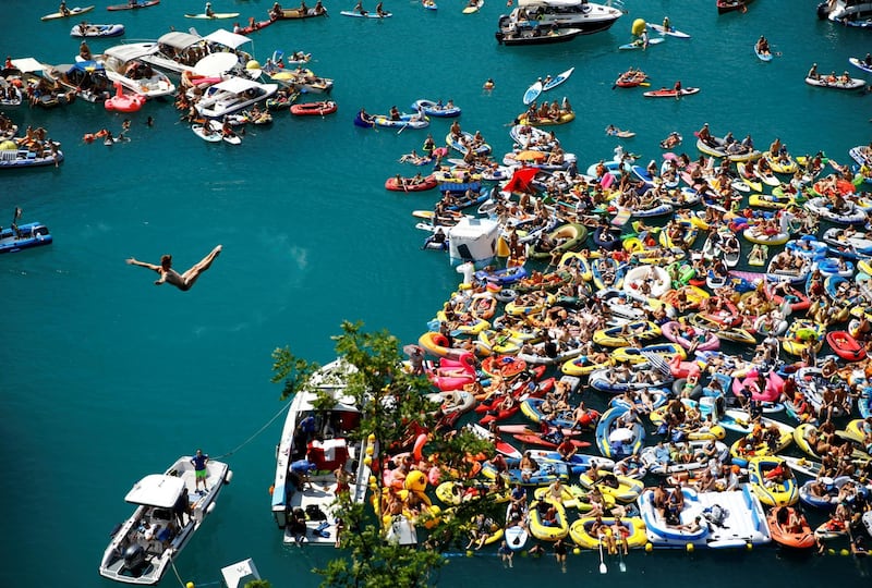 Andy Jones of the US dives from a 27-metre high platform overlooking Lake Lucerne during the the finals of the Red Bull Cliff Diving series in Sisikon, Switzerland. Denis Balibouse/Reuters