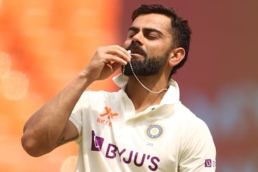 AHMEDABAD, INDIA - MARCH 12: Virat Kohli of India celebrates after scoring his century during day four of the Fourth Test match in the series between India and Australia at Narendra Modi Stadium on March 12, 2023 in Ahmedabad, India. (Photo by Robert Cianflone / Getty Images)