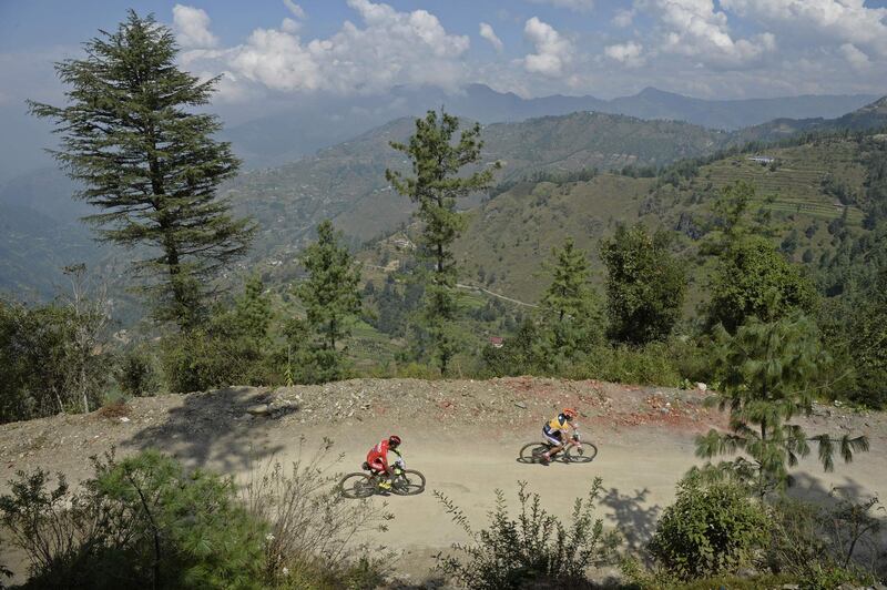 Bike race competitors are pictured during the 14th Hero MTB Himalaya mountain bike race in Bekhalti district on the northern Indian state of Himachal Pradesh. AFP