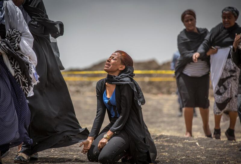 Ethiopian relatives of crash victims mourn and grieve at the scene near Bishoftu, south-east of Addis Ababa, in Ethiopia. AP Photo