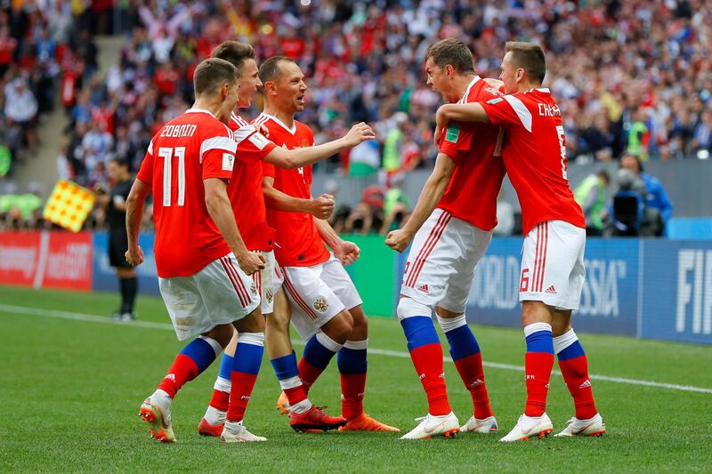 MOSCOW, RUSSIA - JUNE 14:  Artem Dzyuba of Russia celebrates with team mates after scoring his team's third goal  during the 2018 FIFA World Cup Russia Group A match between Russia and Saudi Arabia at Luzhniki Stadium on June 14, 2018 in Moscow, Russia.  (Photo by Kevin C. Cox/Getty Images)