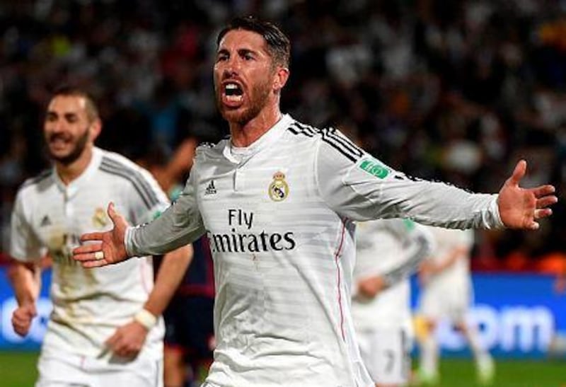 Real Madrid's defender Sergio Ramos celebrates after scoring a goal against San Lorenzo during the Fifa Club World Cup final football match at the Marrakesh stadium in the Moroccan city of Marrakesh on December 20, 2014. AFP PHOTO / FADEL SENNA