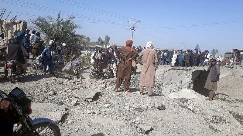 Taliban fighters gather after taking control of Lashkar Gah, the provincial capital of Helmand, Afghanistan. EPA