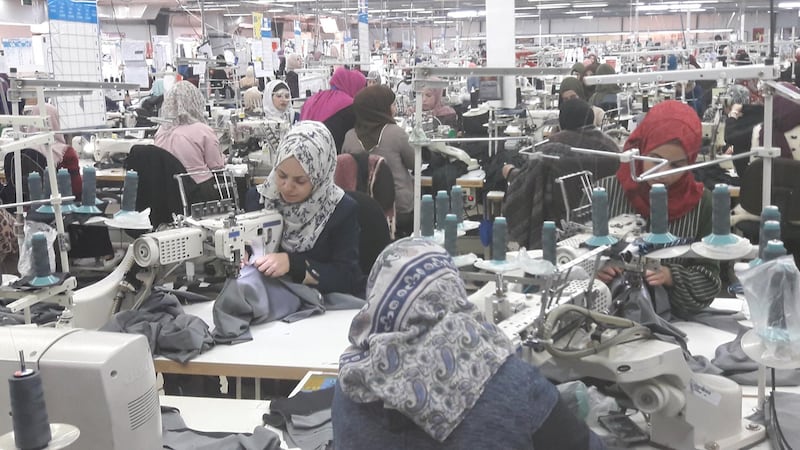 Jordanian women work at the assembly line at Mas Al Kreeda Al Safi factory in Madaba, central Jordan, on March 19, 2018. Taylor Luck for The National