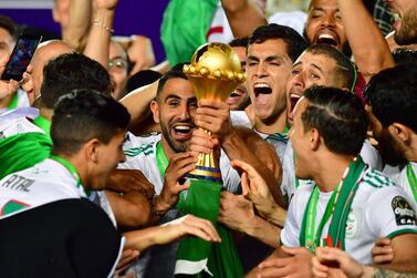 Riyad Mahrez and his Algeria teammates celebrate winning the Africa Cup of Nations. AFP