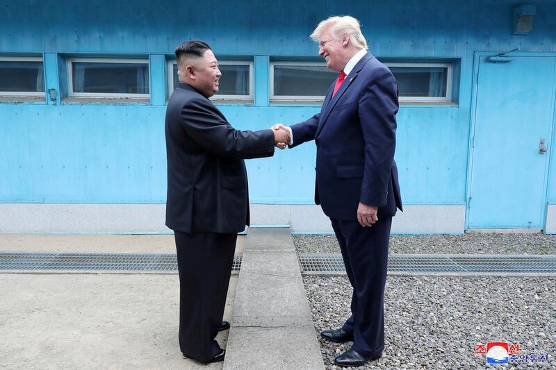 U.S. President Donald Trump shakes hands with North Korean leader Kim Jong Un as they meet at the demilitarized zone separating the two Koreas, in Panmunjom, South Korea, June 30, 2019. KCNA via REUTERS    ATTENTION EDITORS - THIS IMAGE WAS PROVIDED BY A THIRD PARTY. REUTERS IS UNABLE TO INDEPENDENTLY VERIFY THIS IMAGE. NO THIRD PARTY SALES. SOUTH KOREA OUT. NO COMMERCIAL OR EDITORIAL SALES IN SOUTH KOREA.