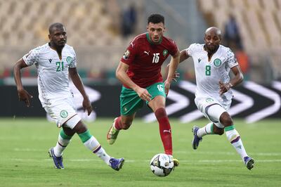 Morocco's midfielder Selim Amallah, centre, fights for the ball with Comoros forward El Fardou Nabouhane, left, and Comoros midfielder Fouad Bachirou. AFP