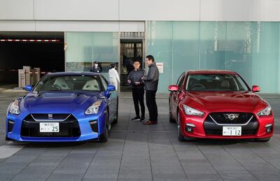 epa08214469 A Nissan Motor Co., Ltd. staff member speaks with a customer at the company's global headquarters in Yokohama, south of Tokyo, Japan, 13 February 2020. Japan's carmaker Nissan posted its results for the third quarter of the 2019 fiscal year, showing a drop in profit of 87.6 percent.  EPA/CHRISTOPHER JUE