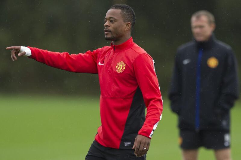Patrice Evra is shown at a Manchester United training session on October 22, 2013. Jon Super / AP 
