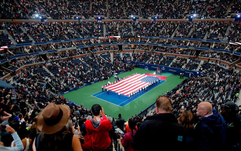 The US flag is displayed before Novak Djokovic of Serbia battles Juan Martin del Potro of Argentina in their 2018 US Open men's singles final match in New York.  AFP