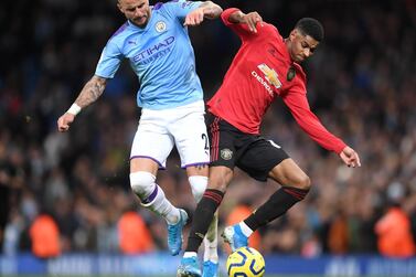 MANCHESTER, ENGLAND - DECEMBER 07: Kyle Walker of Manchester City battles for possession with Marcus Rashford of Manchester United during the Premier League match between Manchester City and Manchester United at Etihad Stadium on December 07, 2019 in Manchester, United Kingdom. (Photo by Laurence Griffiths/Getty Images)