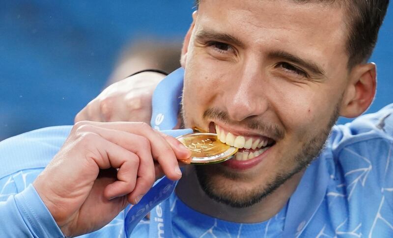 Manchester City's Ruben Dias celebrates winning the Premier League. EPA