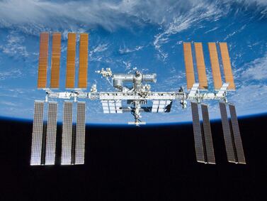 The International Space Station. Astronauts were to remove a faulty electronics box from a communications antenna during their spacewalk. AP