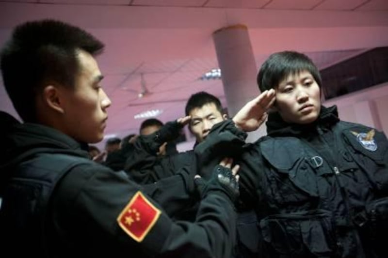 Beijing - December 16, 2011 - Students participate in bodyguard training at International Security Defense College in Beijing, China. Growing wealthy class has opened market for more private security guards in China. (Shiho Fukada for The National) 

